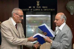 Justice Majithia (left), Chairman of the Wage Boards for working journalists and non-journalists and other newspaper employees, submitting the recommendations to Labour Secretary P.K. Chaturvedi in New Delhi